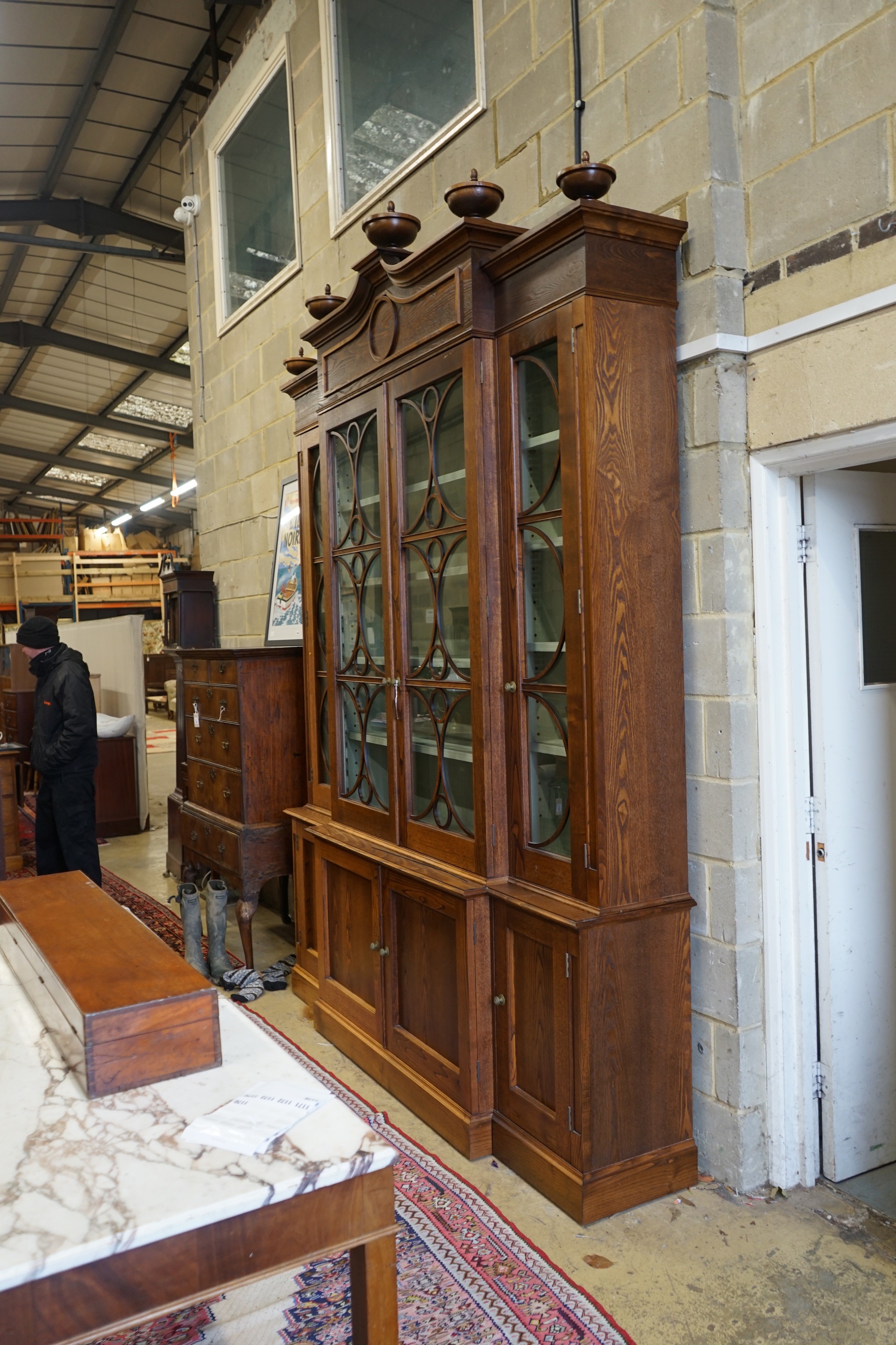 A William Yeoward Cherington chestnut breakfront bookcase, width 220cm, depth 49cm, height 295cm
